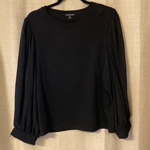 Black blouse with sheer sleeve